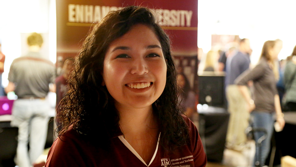 Smiling student ambassador at resource fair