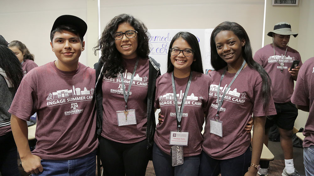 Four summer camp students pose for a photo